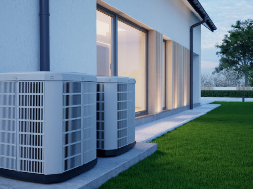 Air heat pump beside house