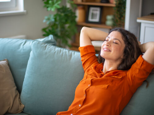 Homeowner relaxing on couch